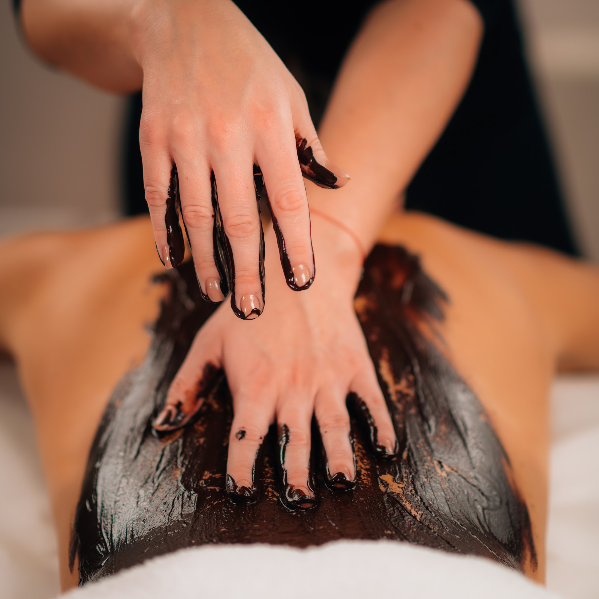 Chocolate Body Massage. Beauty Treatment with rich, cocoa Paste.