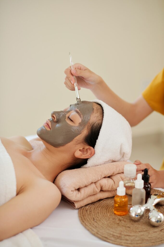 Cosmetologist Applying Clay Mask