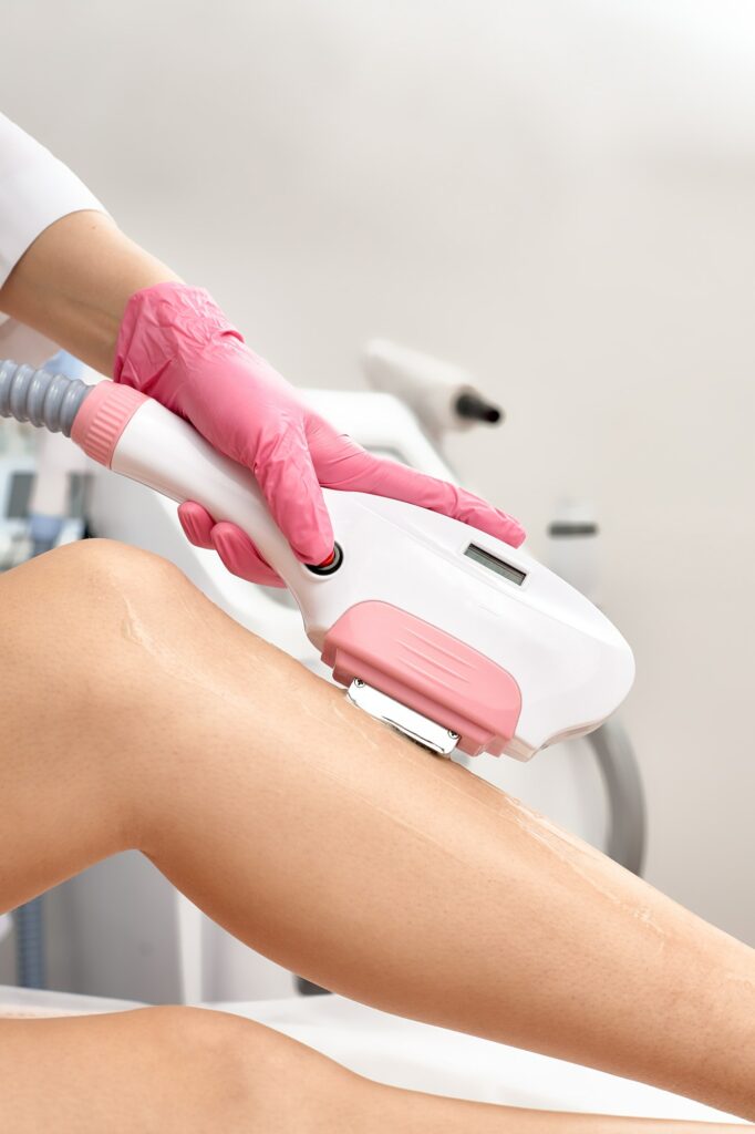 Laser depilation or photoepilator process on a woman leg.